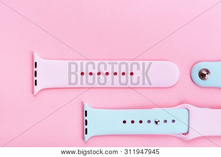 Watchband. Silicone Strap For Sports Watches. Color Bracelet For Smart Watches On Pink Background