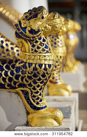 Gold And Blue Stones Covered Animal Figures At The Entance To The Phra Mahathat Vihan In Nakhon Sri 