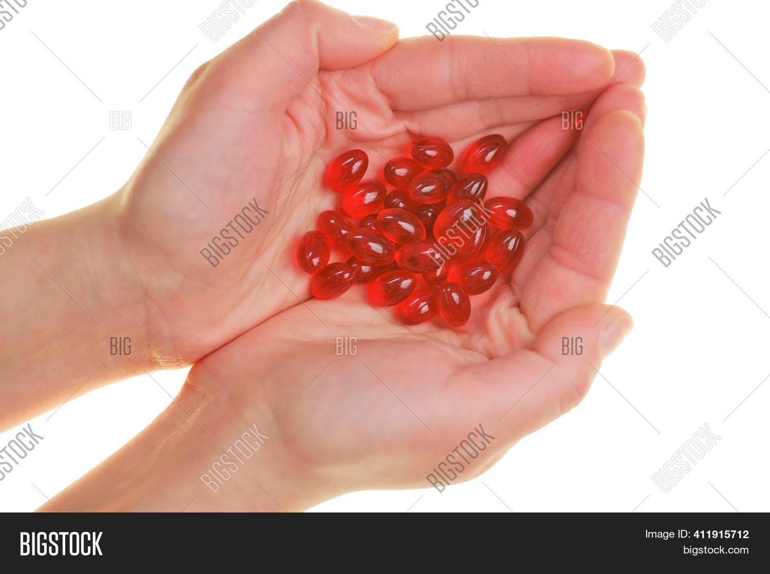 Krill oil capsules in a bottle with a white background