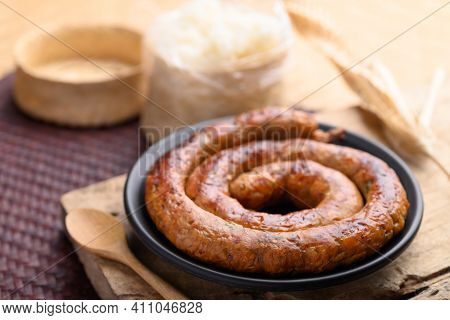 Northern Thai Sausage (sai Aua), Grilled Intestine Stuffed With Minced Pork, Spices And Herbs Eating