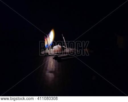 Stock Photo Of A Lighted Matchsticks With Yellow And Blue Color Flame , Matchsticks Which Is Standin