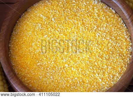 Corn Grits Polenta In A Wooden Bowl. Corn Groats Close Up