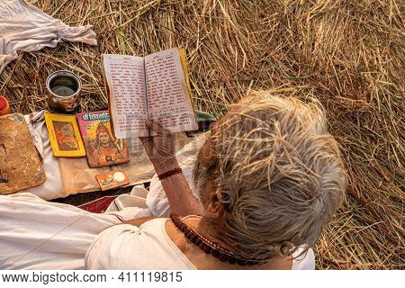 Feburary 2021 Haridawar,india
A Mont Reading The Holly Book During The Kumbh Mela In Haridawar.kumbh