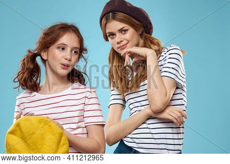 Mom And Daughter Striped T-shirts Hugs Fun Lifestyle Blue Background