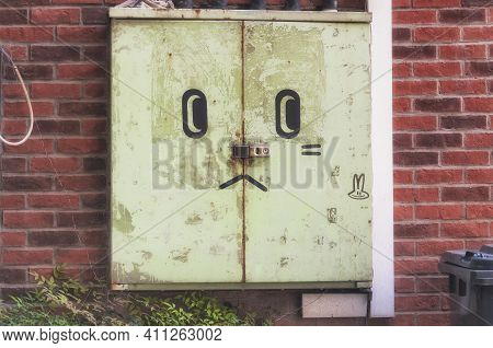 A Weathered Electrical Panel On The Outside Of A Brick Building Inside Of M50 On Moganshan Road In S