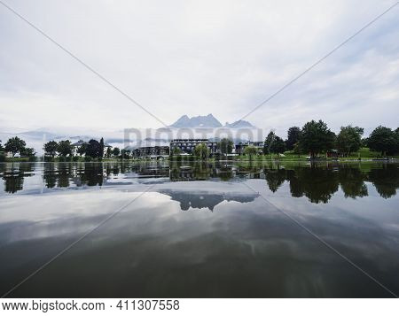 Mirror Reflection Panorama View Of Alps Mountains In Ritzensee Lake Ritzen In Saalfelden Salzburger 