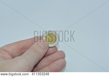 Metal Coins Of The Bank Of Egypt In The Hand Of A The Man