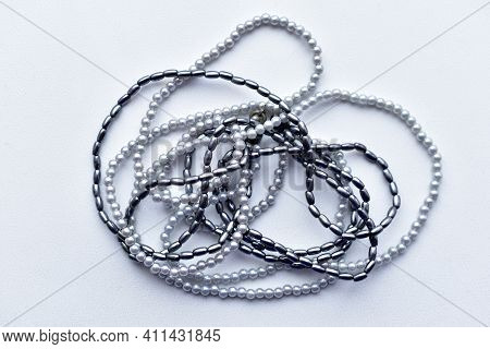 Beads Of Blue Beads On A White Background Costume Jewelry