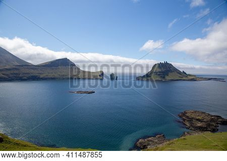 Faroe Islands. Beautiful Landscape - Blue Sky, Sea And Mountains In The Faroe Islands.