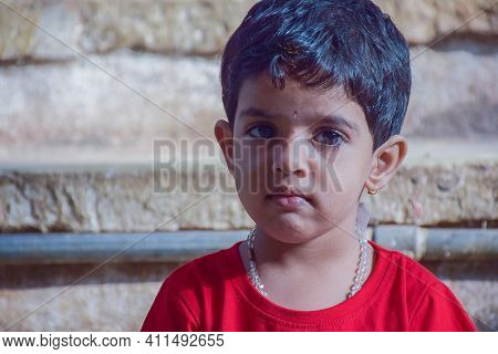 Stock Photo Of A 3 To 7 Years Old Cute Indian Little Girl Who Wearing Red Color T Shirt And Sitting 