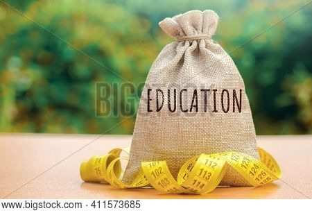 Money Bag With The Word Education. The Concept Of Saving Money For Studies. Investments Of Budgetary