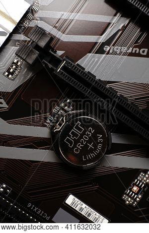Moscow, Russia - March 3 2021: Macrophotograph Of A Modern Branded Motherboard Pc. Dimmed Lights