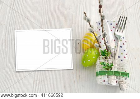 Sweet Easter Symbols Colored Yellow And Green Eggs On White Wooden Table.
Spring Table Setting With 