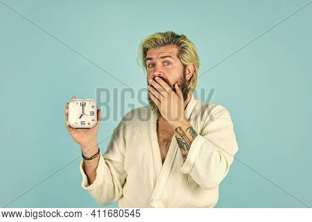 Noise Of Alarm Clock. Man Awake With Alarm Clock Ringing. Guy In Bathrobe. Wake Up In Morning. Time 