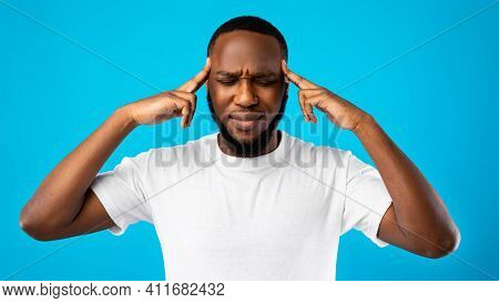 Brainwork. Thoughtful African American Guy Thinking On An Idea Massaging Temples With Eyes Closed St