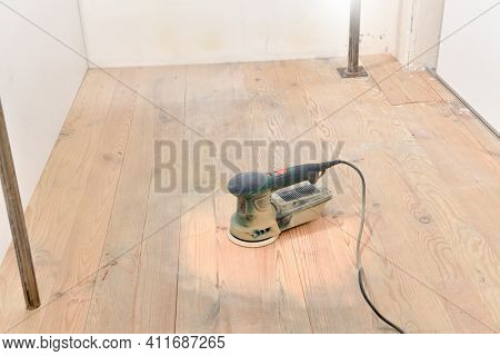 Random orbit sander on hardwood floor   