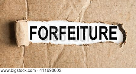 Forfeiture .text On White Paper Over Torn Paper Background.