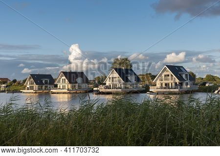 Landscape With Housing Estate On The River Harle In Harlesiel. Harlesiel Is A Holiday Resort In East
