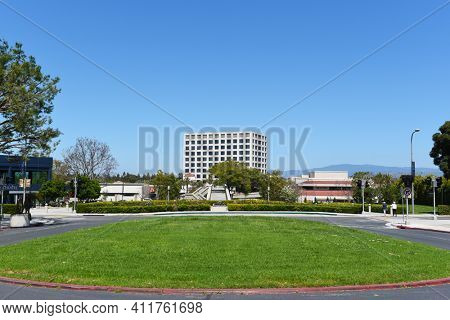 IRVINE, CALIFORNIA - 16 APRIL 2020: Bus Loop looking toward the Wilkening Rose Garden, Watson Bridge and University Center.