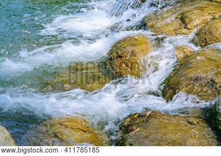 Rock Stone In The Water Covered By Moist Fresh Green Moss, Selective Focus