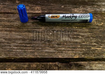 Miercurea Ciuc, Romania- 10 March 2021: Blue Bic Permanent Marker On Aged Pine Wood Boards.
