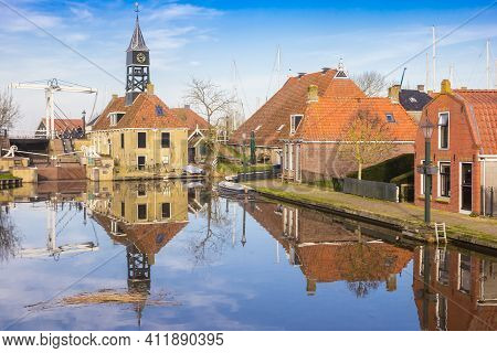 Lock Building With Clock Tower In Historic City Hindeloopen, Netherlands