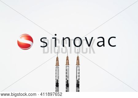 Izmir, Turkey - February 21 2021: Coronavirus Vaccine Concept And Background. Sinovac Vaccine Syring