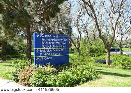 IRVINE, CALIFORNIA - 22 APRIL 2020:  Direction Sign for UC Irvine Health on the Campus of the University of California Irvine, UCI.