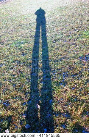 Shadow Of A Person On A Meadow