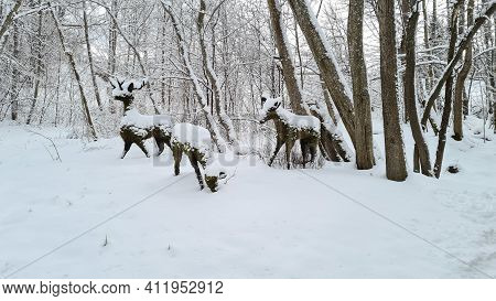 Winter Landscape In The Forest With Artificial Moss Made Of Moss. Deer Sculptures