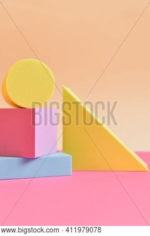 Pink And Yellow Abstract Background With Three-dimensional Geometric Shapes In Pastel Colors. Select
