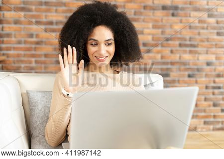 Beautiful African American Girl With Voluminous Dark Hair, Student Involved In Interesting Online Di