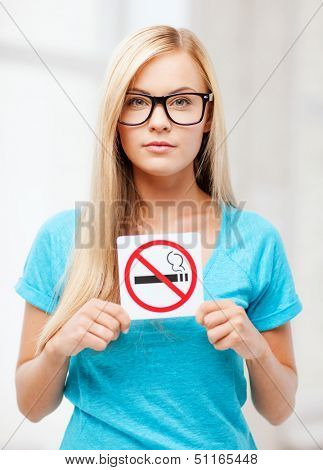 picture of woman with smoking restriction sign .