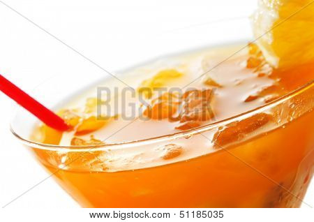 closeup of a cocktail glass with refreshing fruit punch on a white background