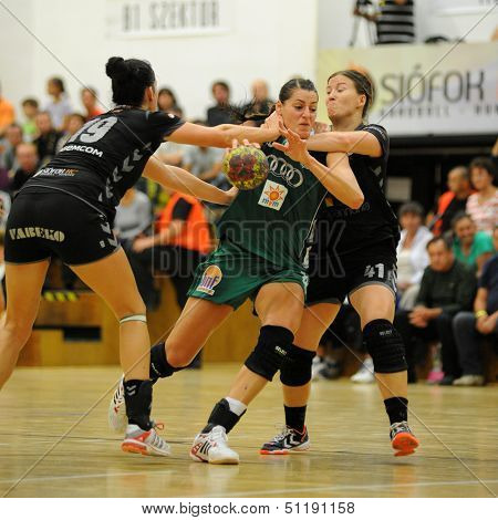 SIOFOK, HUNGARY - SEPTEMBER 14: Eduarda Amorim (in green) in action at a Hungarian Championship handball match Siofok KC (black) vs. Gyori Audi ETO KC (green), September 14, 2013 in Siofok, Hungary.