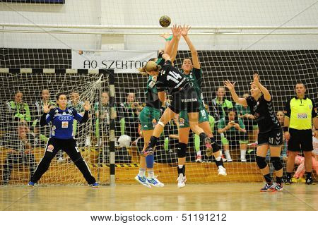 SIOFOK, HUNGARY - SEPTEMBER 14: Unidentified players in action at a Hungarian Championship handball match Siofok KC (black) vs. Gyori Audi ETO KC (green), September 14, 2013 in Siofok, Hungary.