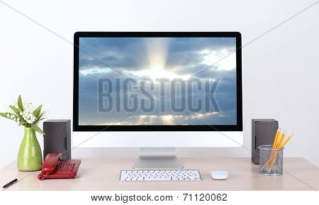 Computer with screensaver on table