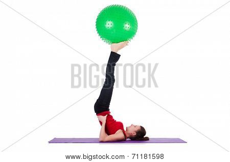 Young woman exercising with swiss ball