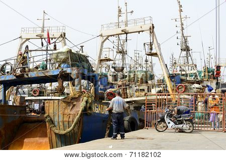 AGADIR, MAROCCO - AUGUST 27: View of fishing boats in Essaouira port on 27 August 2014 in Agadir, Marocco. Morocco is one of the largest producers of sardines in the world.