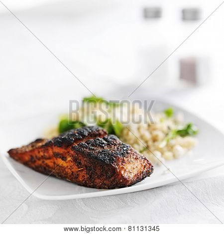 salmon filet with quinoa and arugala