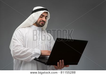Arab working with laptop