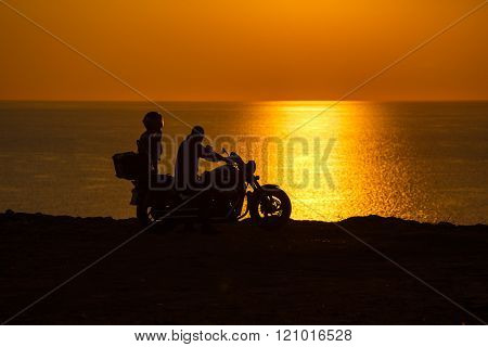 Two People In The Motorcycle At Sunset On The Black Sea
