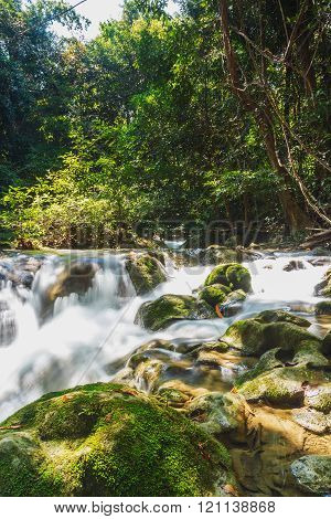 A river headwaters flows over rocks