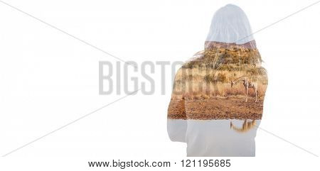 Rear view of man standing in front of glass against view of a giraffe