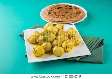 dray potato curry or potato bhaji or aalu bhaji and chapati or roti