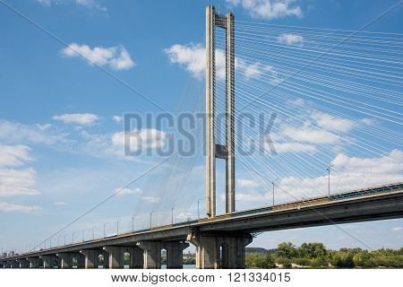 Bridge with spans over river in summer