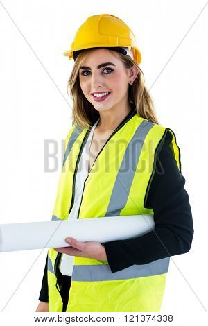 Smiling woman with yellow helmet holding construction plan