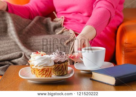 Woman Eat Cupcakes And Drink Tea