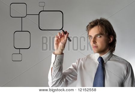Business man drawing a digital graph