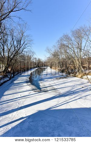 Snow covered Otter Creek River in Vermont from the Hammond Covered Bridge.